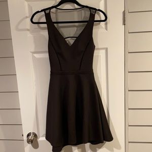 Super flattering black mini dress with sheer cutout on back